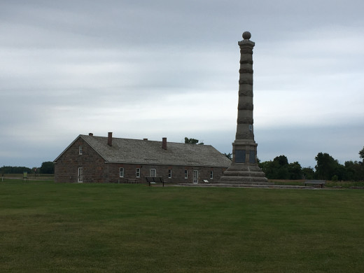 Photo of Fort Ridgely and the tall obelisk monument dedicated to the soldiers who defended the fort during the war.