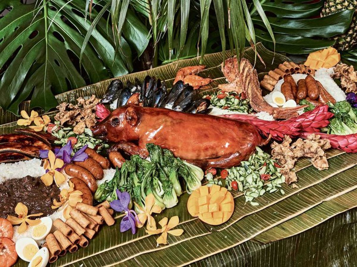 Lechon (whole roasted pig) is a highlight of every Filipino party. Boodle feast is where everyone eats from a table covered with banana leaves w/ their hands and all the foods (except sauce, soup and desserts) are all laid out on the table altogether