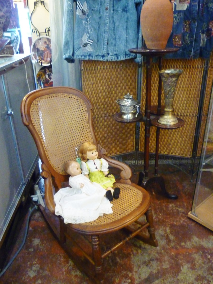 Rocking chair and dolls at AG Antiques on West 19th in the Houston Heights 