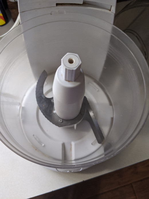 Food processor with blade flipped to grinding spices mode