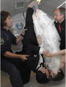 Photo courtesy of http://www.telegraph.co.uk/news/newstopics/howaboutthat/5596173/Head-over-heels-couple-get-married-in-zero-gravity.html