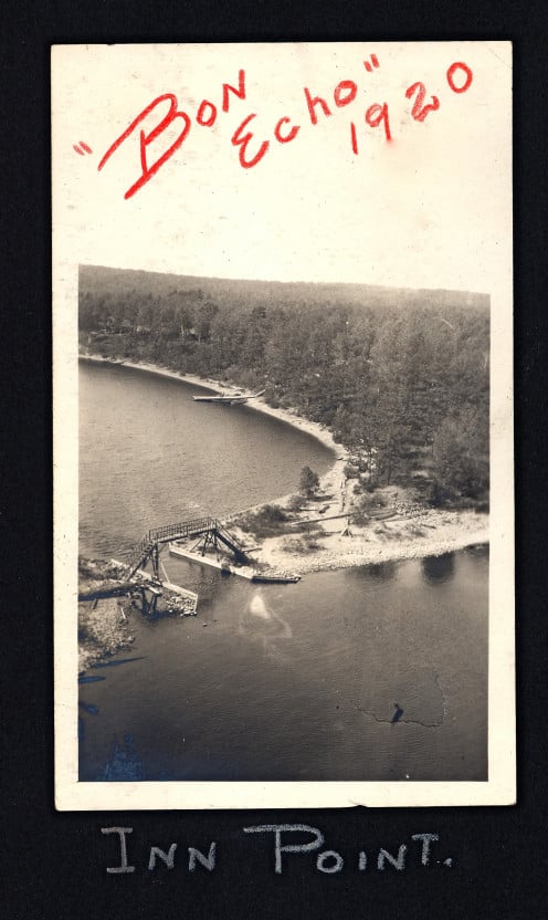 This was how it looked from the top of Mazinaw Rock looking south west, down at the Bon Echo Inn Point in 1920. Bon Echo Inn Point and Bridge. Part of the Alfred Ross Oborne Collection.