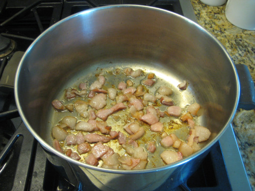 Start by frying the bacon in your soup pot. You can chop it first and fry the smaller pieces, as shown, or fry whole bacon sliced and crumble them later.