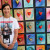 Artist Dania Olivares was standing in front of some of her mixed media pieces.