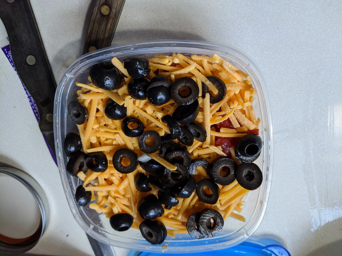 sprinkle sliced black olives across top