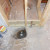 Tub plumbing exposed after demolition 