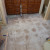 Tiles up exposing the bare floor