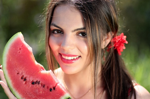 Girl holding a watermelon