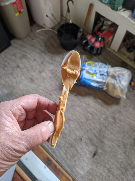 Peanut butter on plastic spoon