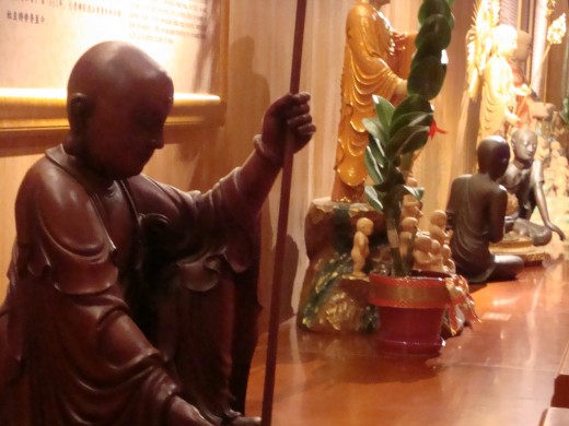 Statues of monks in the upper level