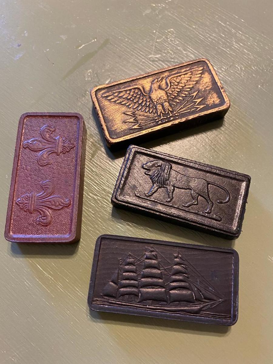 These are some of the different kinds of dominoes in my collection. I love them all.The eagle domino is prepped with gold antiquing rub.