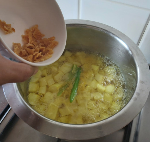 Add 1/2 teaspoon of jaggery (you can skip this step). You can add green chilies and jaggery when radish gets half cooked.