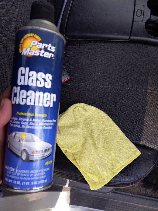 Clean windows with window cleaner and rag, in this case, microfiber towel