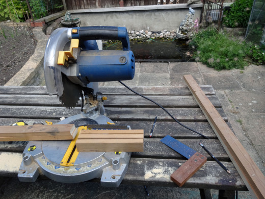 Cutting the three rails of the frame to size with the mitre saw.