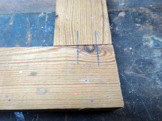 Marking the positions on the butt joints for where the dowel joints will be. 
