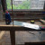 After gluing the dowels in place, cutting the dowel flush with the wood with a Japanese saw.