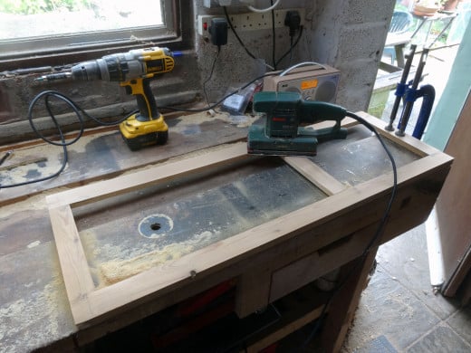 An orbital sander with a fine grade grit used to give a good smooth finish to the surface.