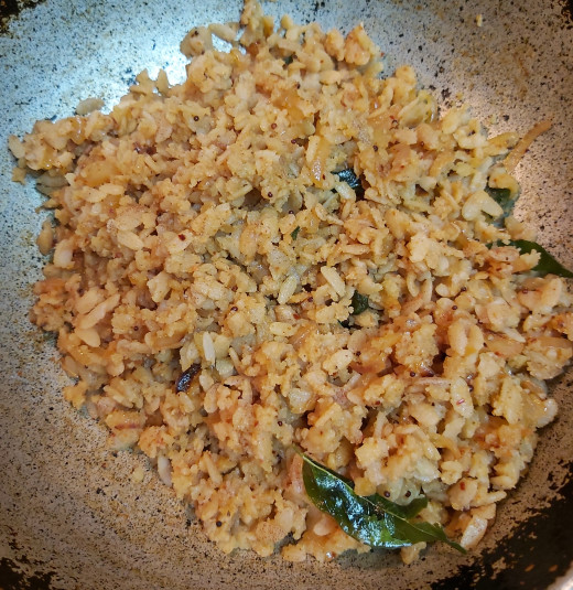 Toss well until all the spices coat well and evenly with poha. Mix gently without breaking the grains. Cook for 1-2 minutes in low flame and switch off the flame.