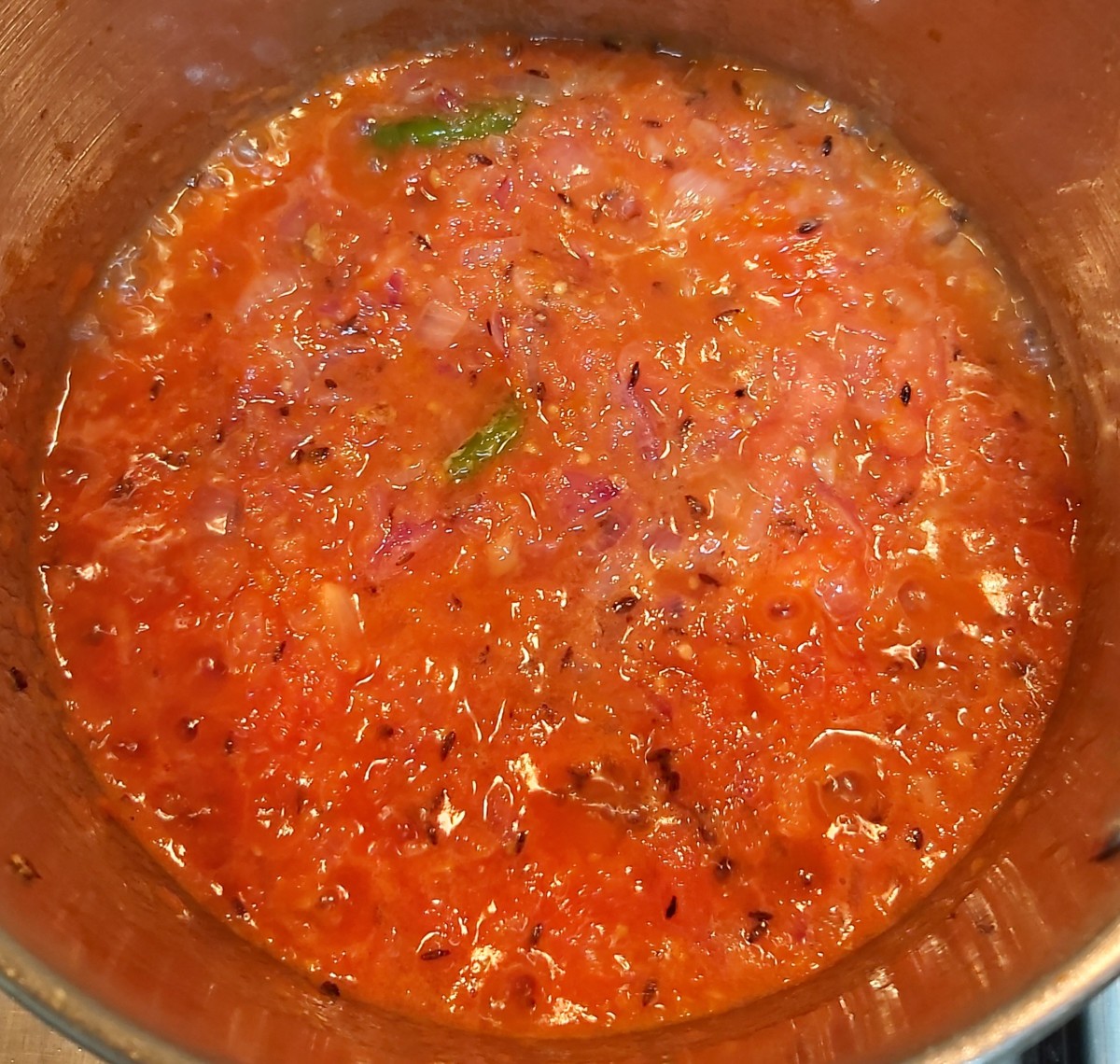Mix well and fry in medium low flame for 2-3 minutes till raw smell of tomatoes goes away.