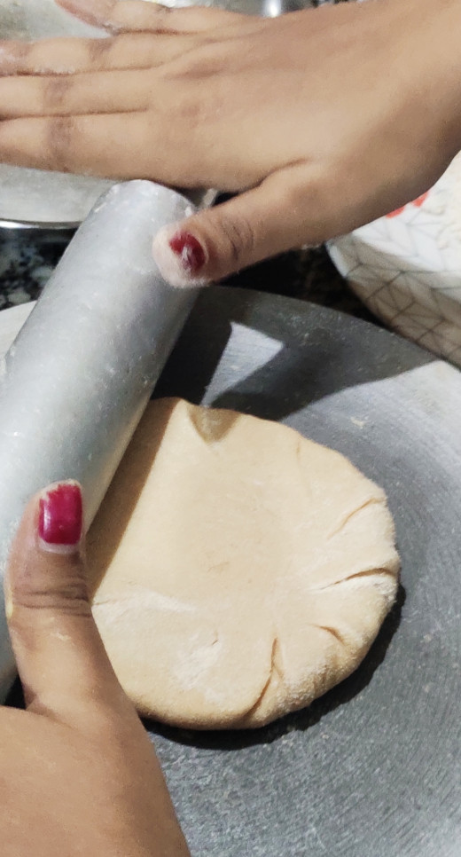 Rolling the paratha