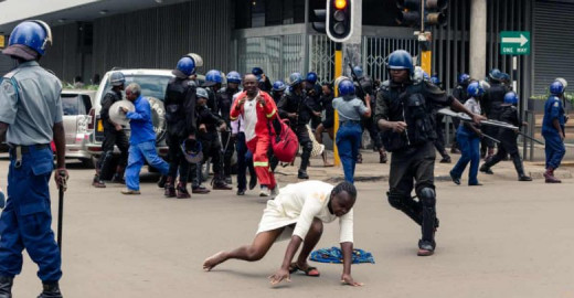 Police beating a defenceless woman in Harare, Zimbabwe