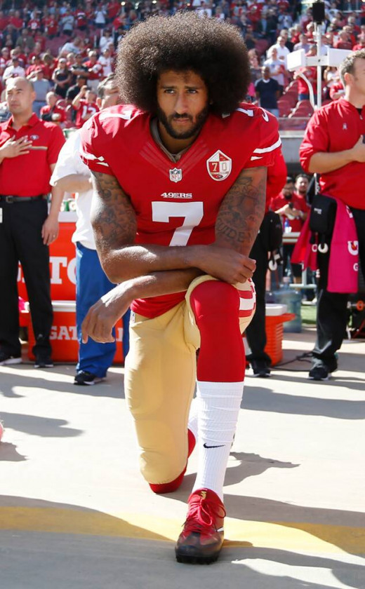 Colin Kaepernick of San Francisco 49ers Kneeling During the National Anthem