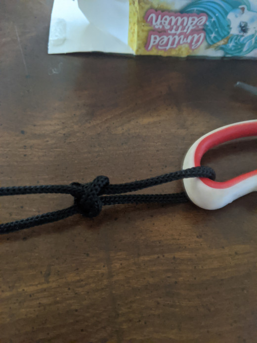 Pull on non free end, usually end connected to rest of string.