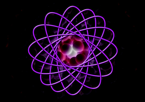 A picture of a large atom with several nuclei in the middle. 