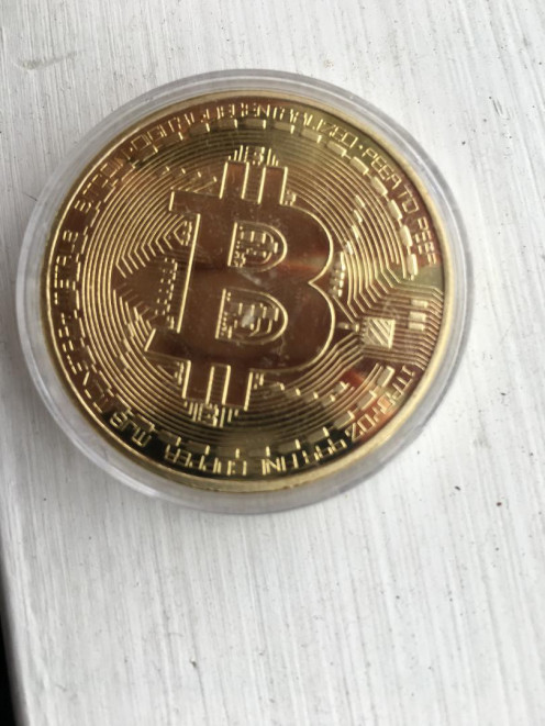 Photo of gold plated bitcoin replica.