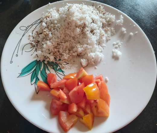 Chop 1-2 ripe tomatoes and 1/2 cup of fresh grated coconut. Keep aside.