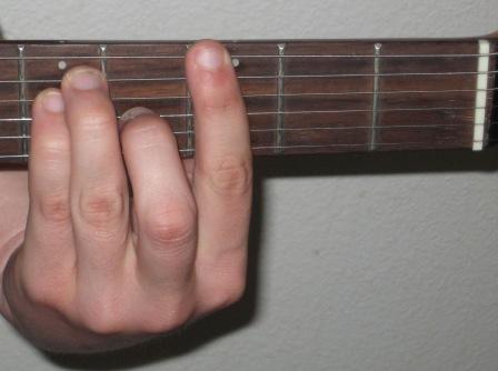 Me making a G Bar Chord on the guitar.