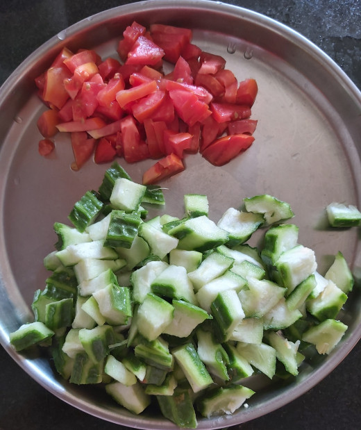 Wash, chop off the ends and peel the stripes of ridge gourd. No need to peel the skin. Chop ridge gourd (remove seeds if any). Wash and chop 1-2 ripe tomatoes. Keep aside.