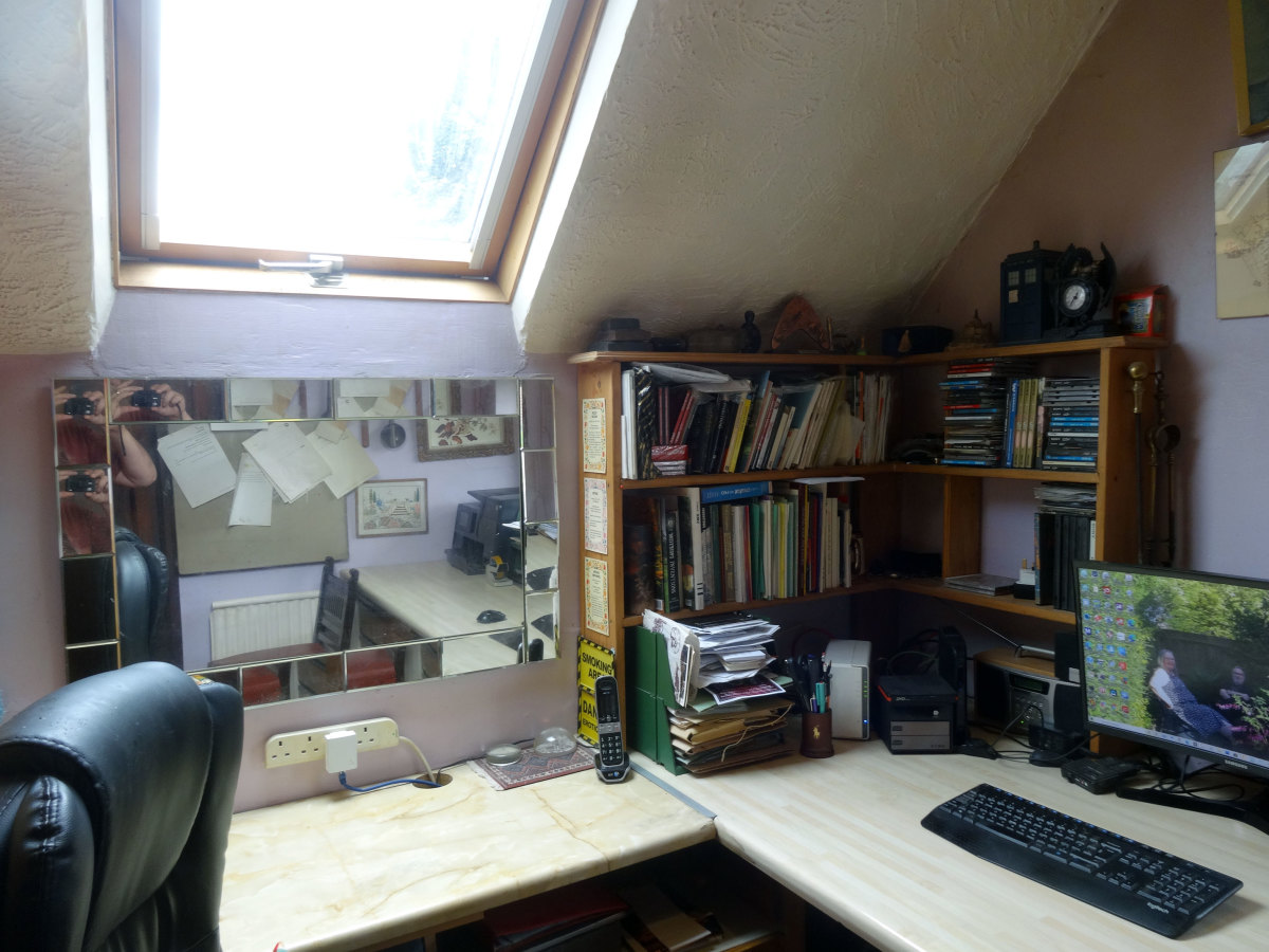 Main and side desks with office mirror and corner shelf unit, before office makeover