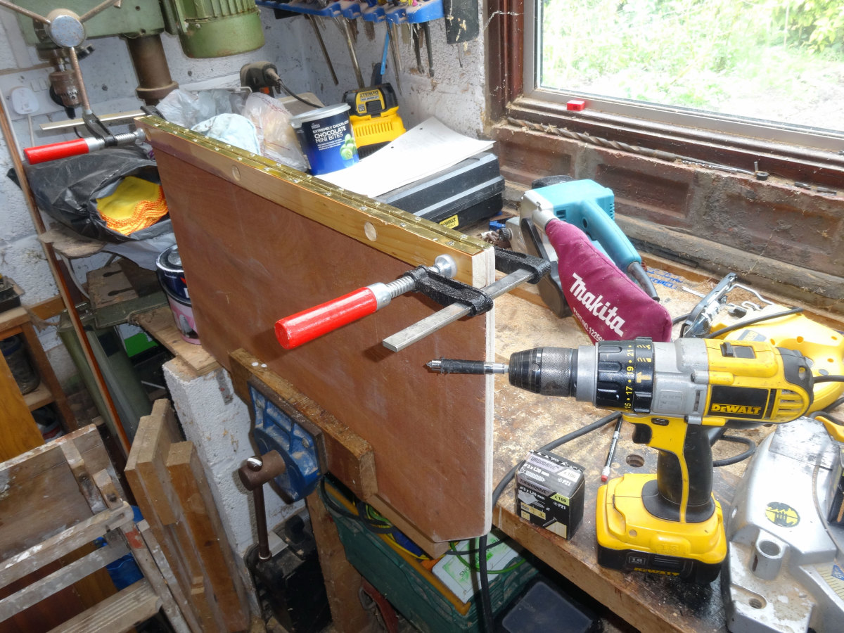 Adding the end piano hinge to one of the door sections
