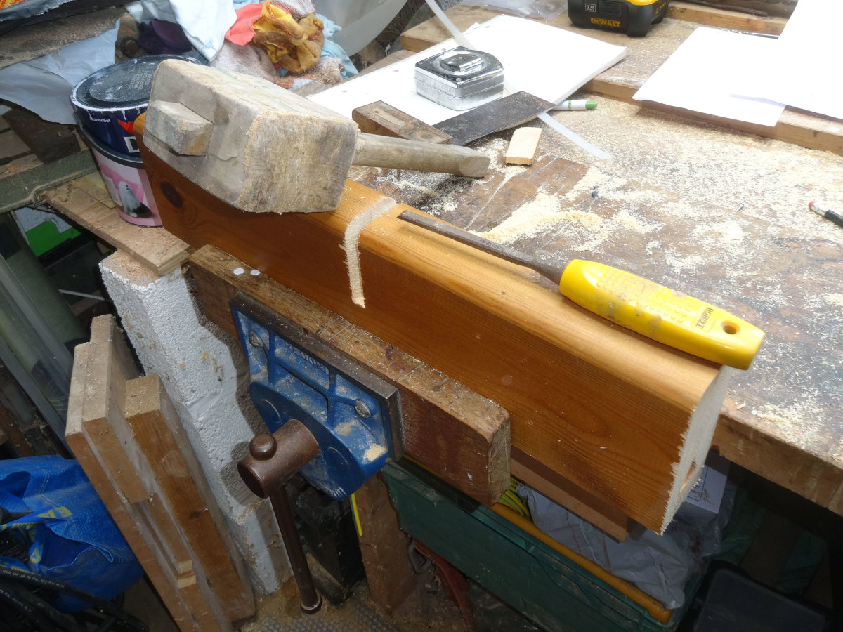 Using a chisel and mallet to knock out the bridle joints