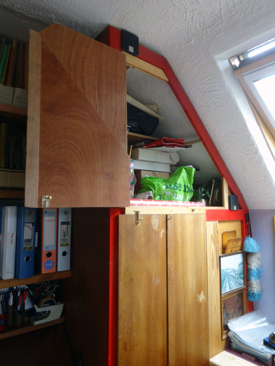 New folding, door fitted to cupboard above wardrobe, in open position.