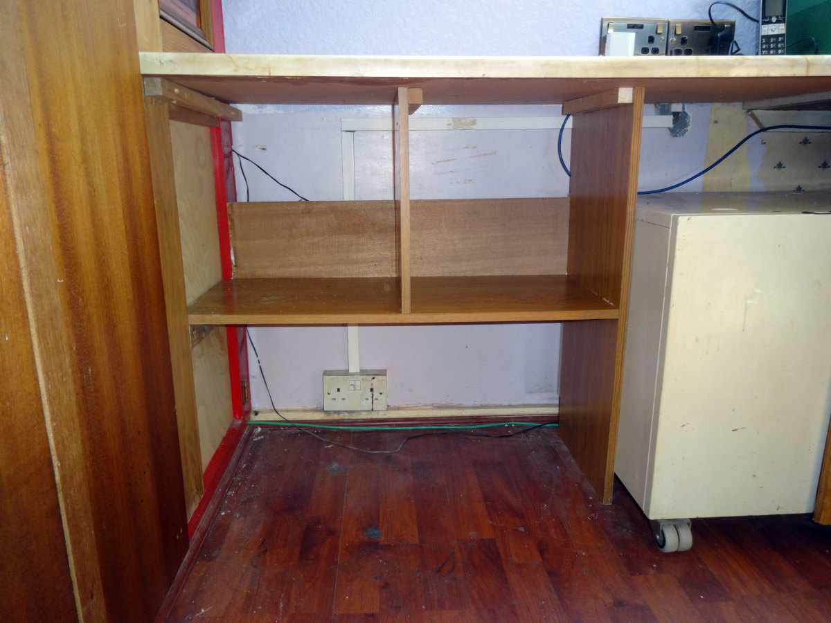 Bespoke shelving unit, showing the space left behind and above the backstop for cable management.