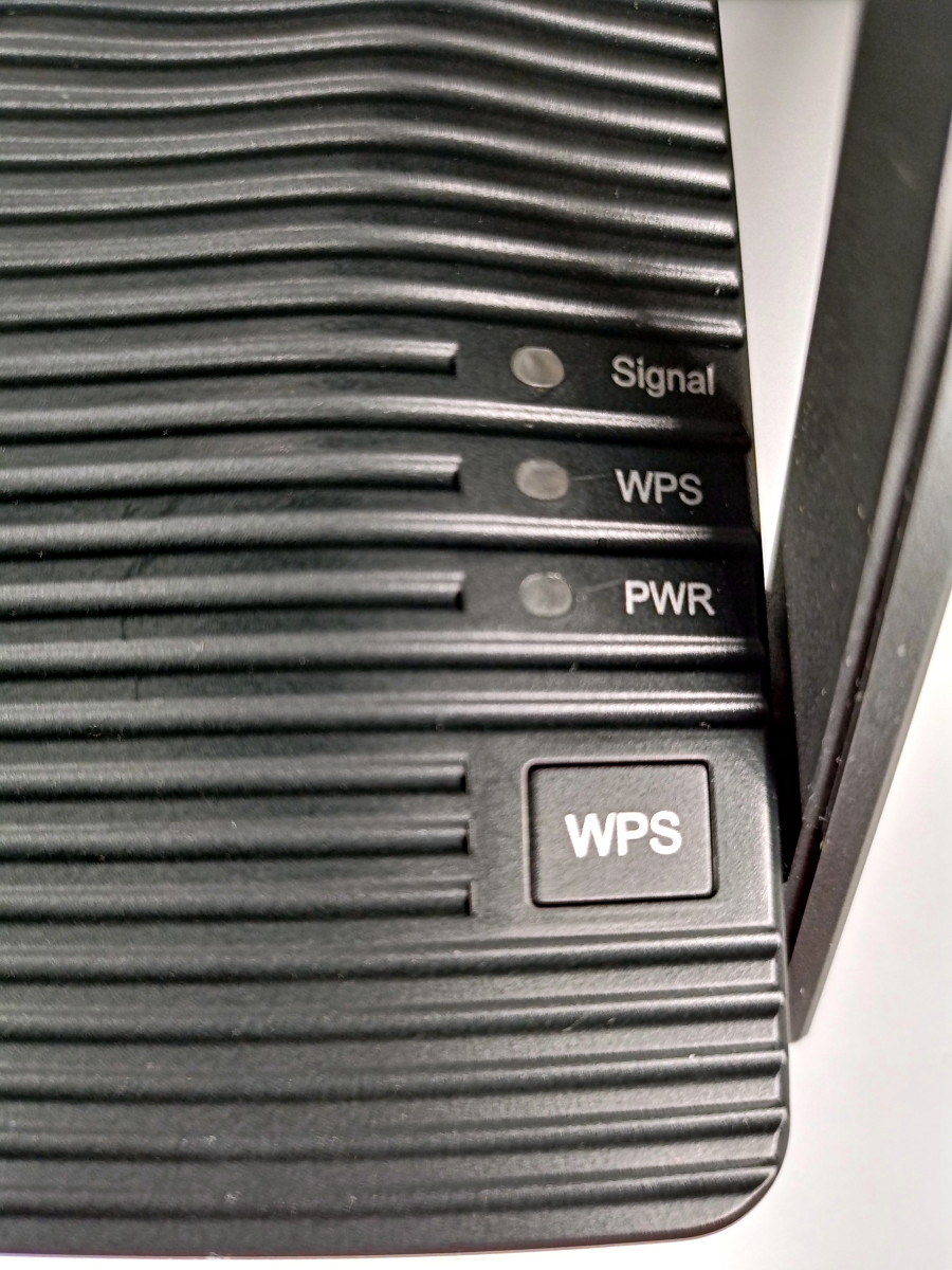 Close up view of WPS button as well as the WPS, power, and signal LEDs