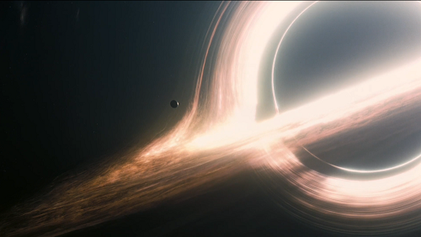 Scene of Miller's planet orbiting a large black hole named Gargantua.