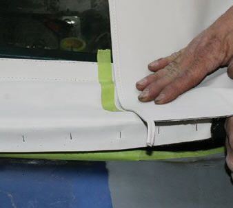 Alignment is vital. Here, the right quarter of the main top is OVER the rear window curtain before stapled.