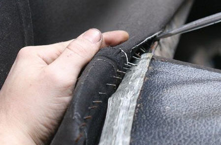 Removing staples from the top rear bow.