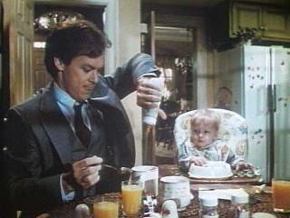 Mr. Mom, Dad pours baby's formula into his coffee when out of creamer.