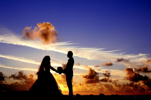 Married couple in the sunset moment