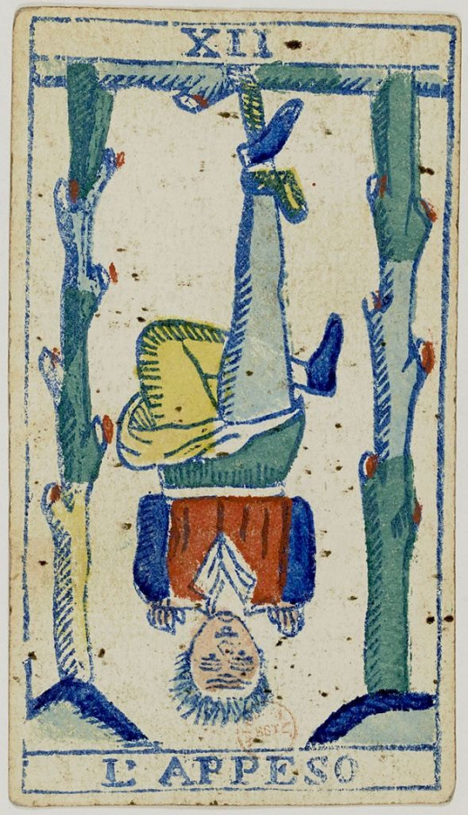 Even in very old Tarot decks, The Hanged Man hangs by his foot. In suspension, he has time to reflect on all he has done. This Italian deck is called the "Piedmontese" deck. The modern Tarot reader equates The Hanged Man with a retreat or vacation.
