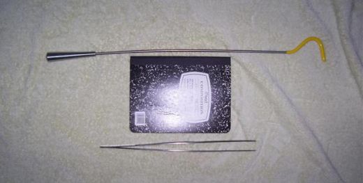 large hook and tweezers