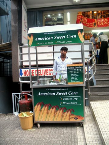American hot Popcorn right on footpath in front of a Dept Store