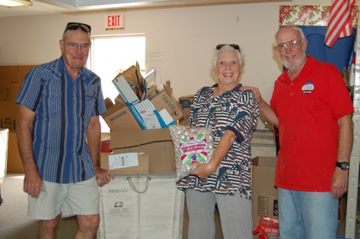 These folks are DeWayne, Peg and Tom.  DeWayne helps pack food boxes. Peg is pretty much in charge of what gets packed in the hygiene room and her husband, Tom, helps with that and whatever else needs doing. 
