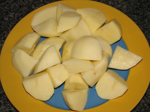 Peeled and quartered potatoes ready for boiling. Peeled and quartered potatoes ready for boiling.