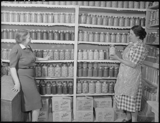 Where to put the grocery stockpile or year's supply? This photo from the National Archives shows women in the 1940s with a stockpile of home canned food from their victory gardens.