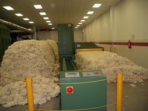 You can see Opened Cotton from Bales that are fed to the Blow Room Machine at the feed end.